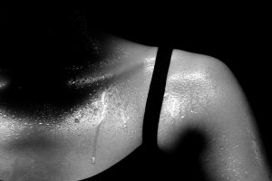 Close up of sweating woman's shoulder